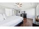 Bright bedroom with hardwood floors, a modern dresser, and comfortable pillows at 476 Sapphire Dr, Carmel, IN 46032