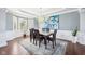 Bright dining room with wood floors, natural light, and adjacent to the kitchen at 476 Sapphire Dr, Carmel, IN 46032