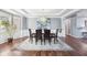 Formal dining room featuring wood floors, decorative chandelier and large windows at 476 Sapphire Dr, Carmel, IN 46032