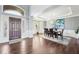 Inviting dining room features wood floors, arched doorway and large windows for natural light at 476 Sapphire Dr, Carmel, IN 46032