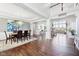 Elegant dining area with wood floors, modern chandelier and an open floorplan at 476 Sapphire Dr, Carmel, IN 46032