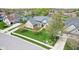 Beautiful brick home features lush lawn, mature trees, and landscaping at 476 Sapphire Dr, Carmel, IN 46032