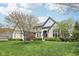 Beautiful two-story home showcasing well-kept lawn, mature trees, and a brick exterior at 476 Sapphire Dr, Carmel, IN 46032