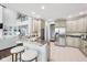 Modern kitchen with granite countertops, stainless steel appliances, and a breakfast bar at 476 Sapphire Dr, Carmel, IN 46032