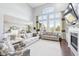 Open-concept living room with hardwood floors, high ceilings, and large windows at 476 Sapphire Dr, Carmel, IN 46032