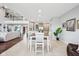 Open-concept living space with views of the kitchen, living, and dining areas, enhanced by natural light at 476 Sapphire Dr, Carmel, IN 46032