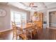 Elegant dining room featuring hardwood floors, a bay window, and traditional wooden furniture at 504 S Lebanon St, Lebanon, IN 46052