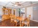 Traditional dining room featuring a wooden table, decorative hutch, and hardwood floors at 504 S Lebanon St, Lebanon, IN 46052
