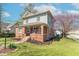Charming two-story home with a brick facade, landscaped front yard, and inviting front porch at 504 S Lebanon St, Lebanon, IN 46052