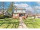 Attractive home featuring a well-manicured lawn, sidewalk, and mature trees in a residential neighborhood at 504 S Lebanon St, Lebanon, IN 46052