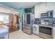 Spacious kitchen showcasing stainless steel appliances, white cabinets, and seamless access to dining area at 504 S Lebanon St, Lebanon, IN 46052