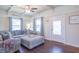 Cozy living room with a comfortable sectional sofa, ottoman, and large windows for natural light at 504 S Lebanon St, Lebanon, IN 46052