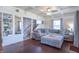 Bright living room with a gray sofa, hardwood floors, and a staircase leading to the upper level at 504 S Lebanon St, Lebanon, IN 46052