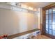 Functional mud room with a built-in bench, coat hooks, and storage shelves for organization at 504 S Lebanon St, Lebanon, IN 46052