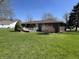 The property features a lovely green lawn and a brick exterior at 508 E Hillside Dr, Anderson, IN 46011
