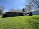 The property boasts a green lawn and a lovely brick exterior at 508 E Hillside Dr, Anderson, IN 46011