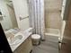 Cozy bathroom featuring tile flooring, shower/tub combo, and vanity at 508 E Hillside Dr, Anderson, IN 46011