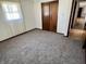 Bedroom with neutral carpeting and a closet for storage at 508 E Hillside Dr, Anderson, IN 46011