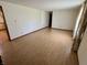 Spacious living room with hardwood floors and large windows allowing ample natural light at 508 E Hillside Dr, Anderson, IN 46011