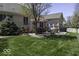 Inviting backyard patio features ample seating, a grill, and a well-maintained lawn perfect for entertaining at 537 Weyworth Pl, Greenwood, IN 46142