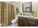 Bathroom features granite vanity, decorative shower curtain, and built in medicine cabinet at 537 Weyworth Pl, Greenwood, IN 46142