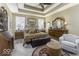 Comfortable bedroom features a tray ceiling, sitting area, and neutral decor at 537 Weyworth Pl, Greenwood, IN 46142