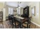 Traditional dining room with dark wood table, chairs, and china cabinet on a decorative rug at 537 Weyworth Pl, Greenwood, IN 46142