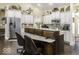 Gourmet kitchen featuring granite countertops, stainless steel appliances, white cabinets, and a convenient island with barstool seating at 537 Weyworth Pl, Greenwood, IN 46142