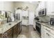 Bright kitchen features granite counters, stainless appliances, and white and wood cabinets at 537 Weyworth Pl, Greenwood, IN 46142