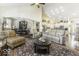 Open concept living room with vaulted ceiling, comfortable seating, and open layout to kitchen at 537 Weyworth Pl, Greenwood, IN 46142