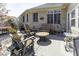 Outdoor patio with ample seating, including Adirondack chairs and a dining table under an umbrella at 537 Weyworth Pl, Greenwood, IN 46142