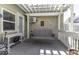 Covered patio featuring a porch swing, white pergola, and brick exterior wall at 537 Weyworth Pl, Greenwood, IN 46142