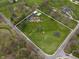 Aerial view of a large lot with a home, pool, and mature landscaping at 5455 S 800 E, Zionsville, IN 46077