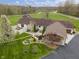 Aerial view of a home, landscaped yard, patios, and driveway at 5455 S 800 E, Zionsville, IN 46077