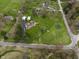 Stunning aerial view of a lush property with a pool, outbuilding, and well-manicured lawn at 5455 S 800 E, Zionsville, IN 46077