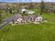 Aerial view of a home with a pool, long driveway, and well-manicured lawn at 5455 S 800 E, Zionsville, IN 46077
