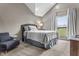 A modern bedroom featuring plush carpet, a large window, and neutral paint colors, creates a calming space at 5455 S 800 E, Zionsville, IN 46077