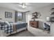 This bedroom has natural light with a ceiling fan, and classic decor that creates a cozy atmosphere at 5455 S 800 E, Zionsville, IN 46077