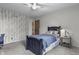 A classic bedroom with a wood door, neutral carpet, and statement wallpaper with a birch tree pattern at 5455 S 800 E, Zionsville, IN 46077