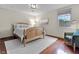 Comfortable bedroom with wood floors, a cozy rug, and a chair at 5455 S 800 E, Zionsville, IN 46077