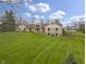 Inviting exterior featuring stone, siding, manicured lawn, and flower beds on a landscaped lot at 5455 S 800 E, Zionsville, IN 46077
