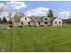 Charming stone and siding home featuring a well manicured lawn and inviting front entrance at 5455 S 800 E, Zionsville, IN 46077