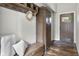 Charming foyer with a hall tree, wardrobe, bench, and wood floors at 5455 S 800 E, Zionsville, IN 46077