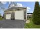 Spacious three-car garage with a well-maintained driveway and picturesque backyard views at 5455 S 800 E, Zionsville, IN 46077
