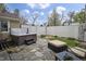 Private backyard featuring a hot tub, stone patio, and outdoor seating area for relaxation at 5455 S 800 E, Zionsville, IN 46077