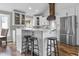 Modern kitchen with white cabinetry, a center island, and stainless steel appliances at 5455 S 800 E, Zionsville, IN 46077