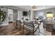 A living room featuring sliding barn doors, a decorative fireplace, a window, and a decorative coffee table at 5455 S 800 E, Zionsville, IN 46077