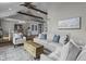 Inviting living room with beamed ceilings, plush seating, and warm hardwood floors at 5455 S 800 E, Zionsville, IN 46077