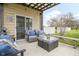 Cozy outdoor patio seating area with a pergola, stylish furniture, and a well-maintained lawn at 5455 S 800 E, Zionsville, IN 46077