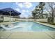 In-ground pool featuring a slide, built-in lounge, and basketball hoop at 5455 S 800 E, Zionsville, IN 46077